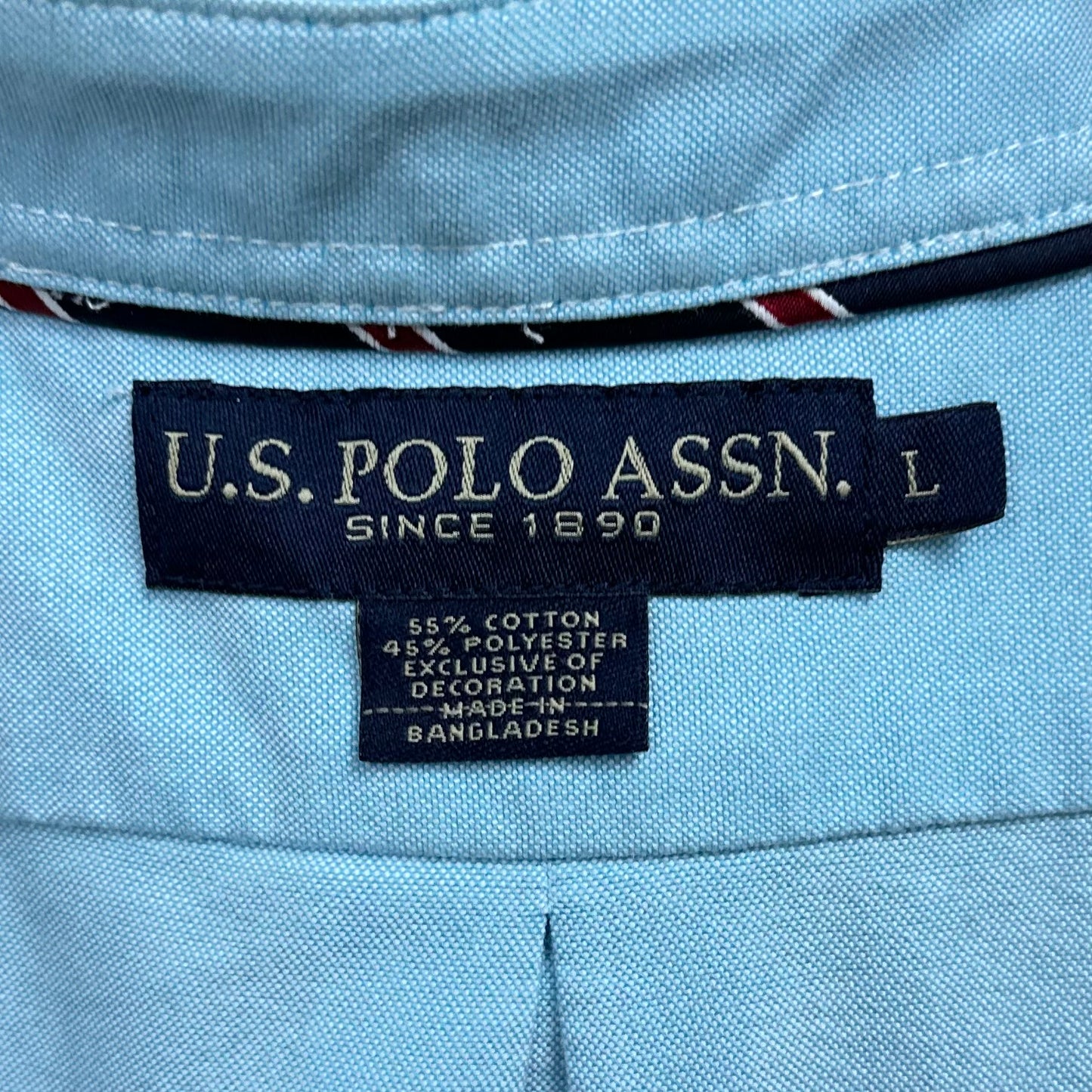 Camisa de botones U.S. Polo Assn. 🐎 en color celeste Talla L Entalle Regular