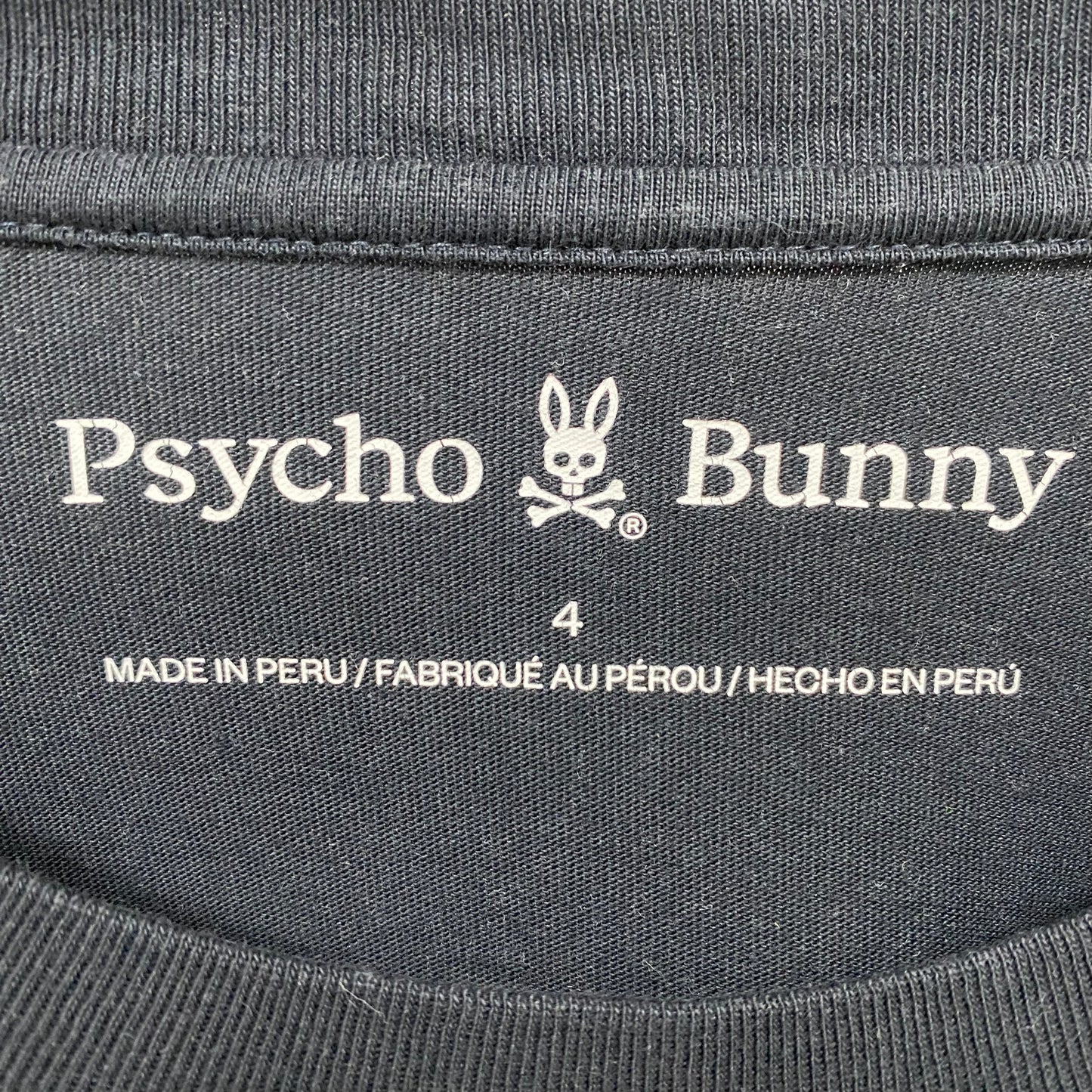Camiseta cuello redondo Psycho Bunny 🐰 color negro y franja en color blanco Talla Small