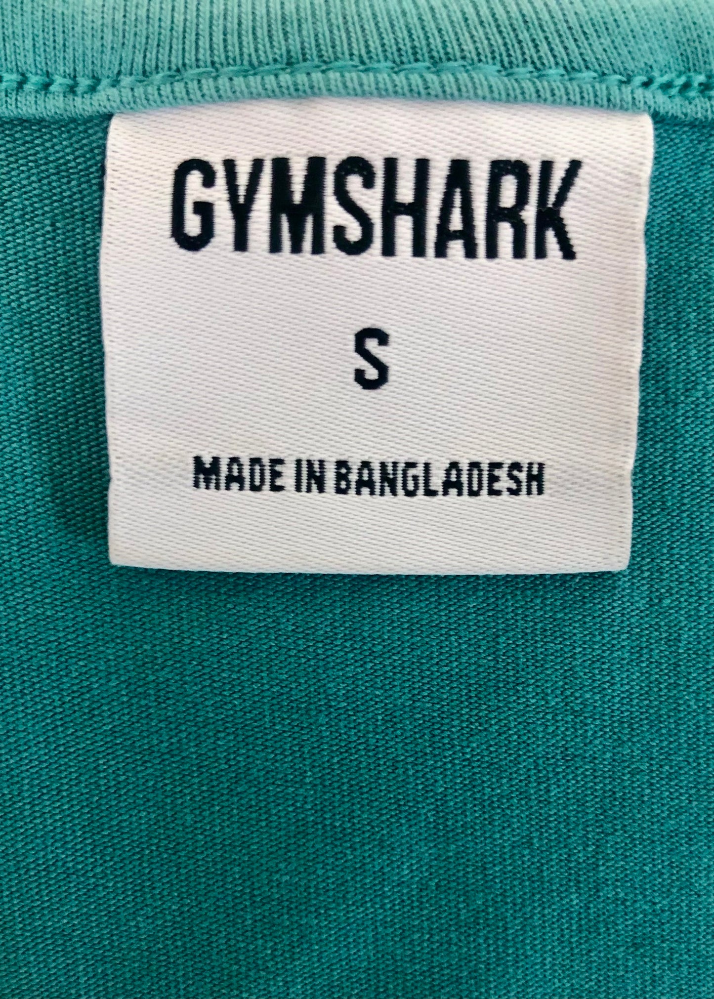 Camiseta de entrenamiento sin mangas Gymshark 🏋🏽 color verde esmeralda y logo en negro Talla S