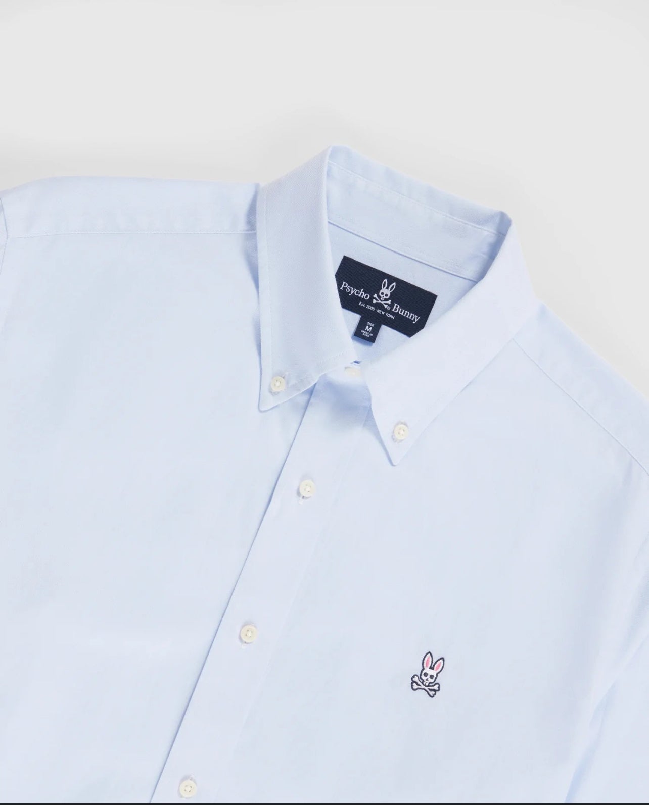 Camisa de botones Psycho Bunny 🐰 Color celeste claro con logo tradicional Talla XL Entalle Regular