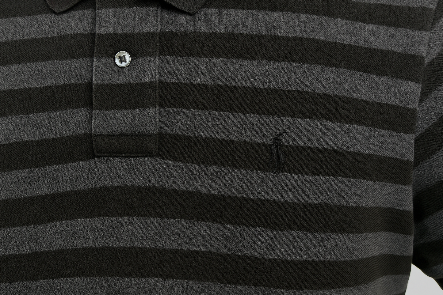 Detail shot of polo player logo and stripes