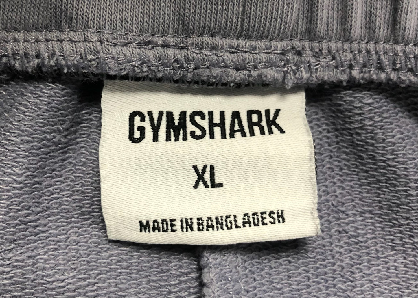 Short Lounge Gymshark 🏋🏼‍♂️ color gris y logo en blanco Talla XL