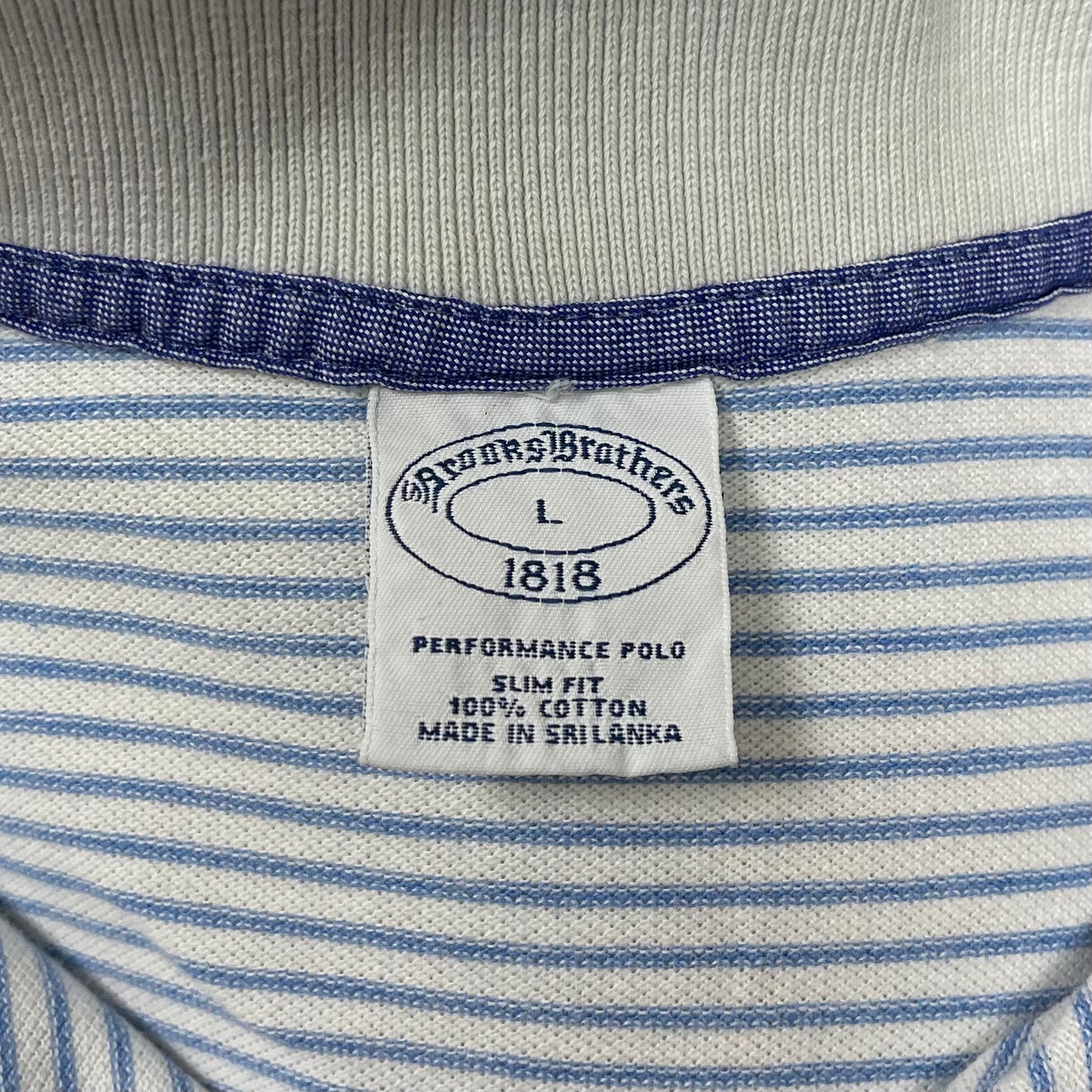 Camiseta Polo Brooks Brothers 🐑 color blanco con patrón de rayas en color celeste Talla L Entalle Regular