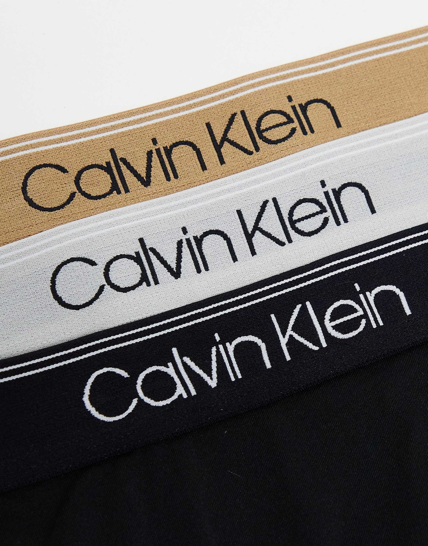 Paquete de 3 Calzoncillos tipo Boxer Calvin Klein de Microfibra Stretch en negro con cintura en dorado, blanco y negro - Tela ligera en Talla XL