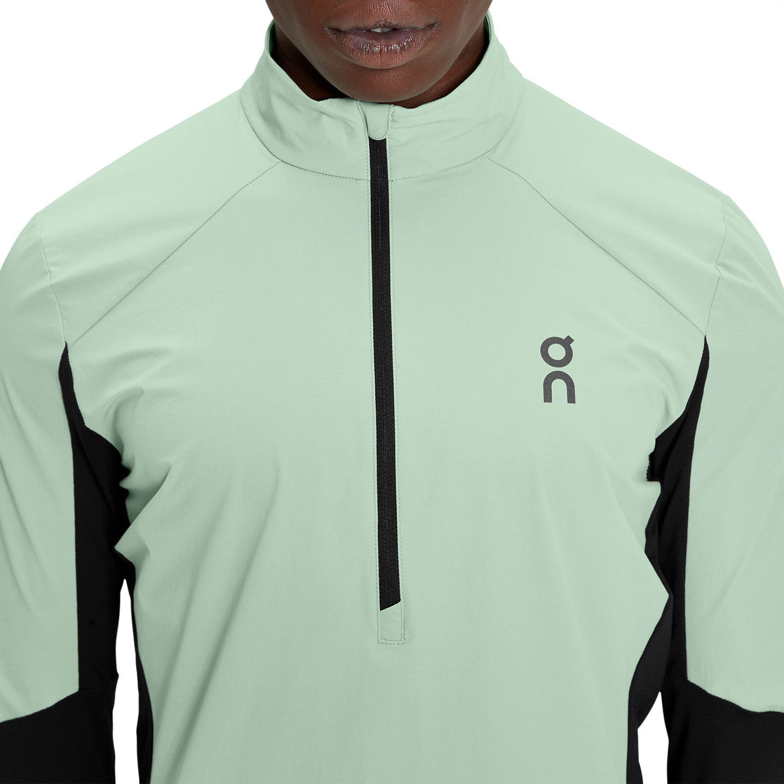 Sueter Jersey On Running 🏃🏻 Impermeable en color verde menta y negro con logo en color gris oscuro Talla L Entalle Regular