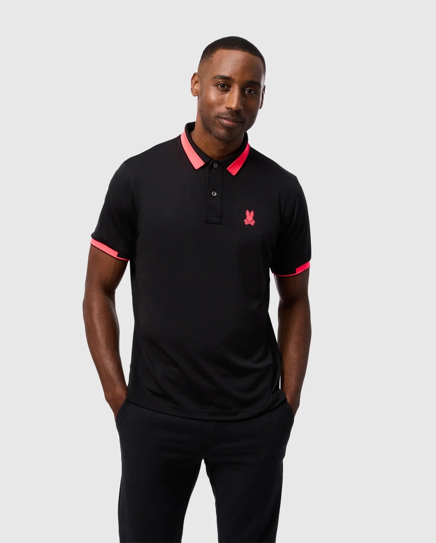 Camiseta Polo Psycho Bunny 🐰  Micro mesh en color negro y rosado con diseño de cuello Talla M Entalle Regular