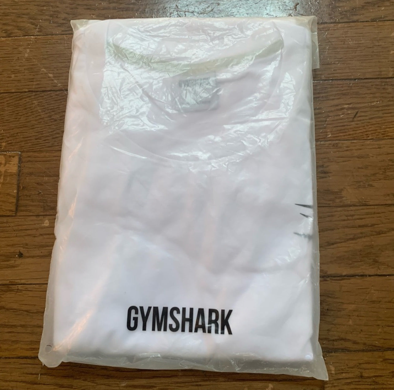 Camiseta de entrenamiento Gymshark 🏋🏽 color blanco y logo en negro Talla XL