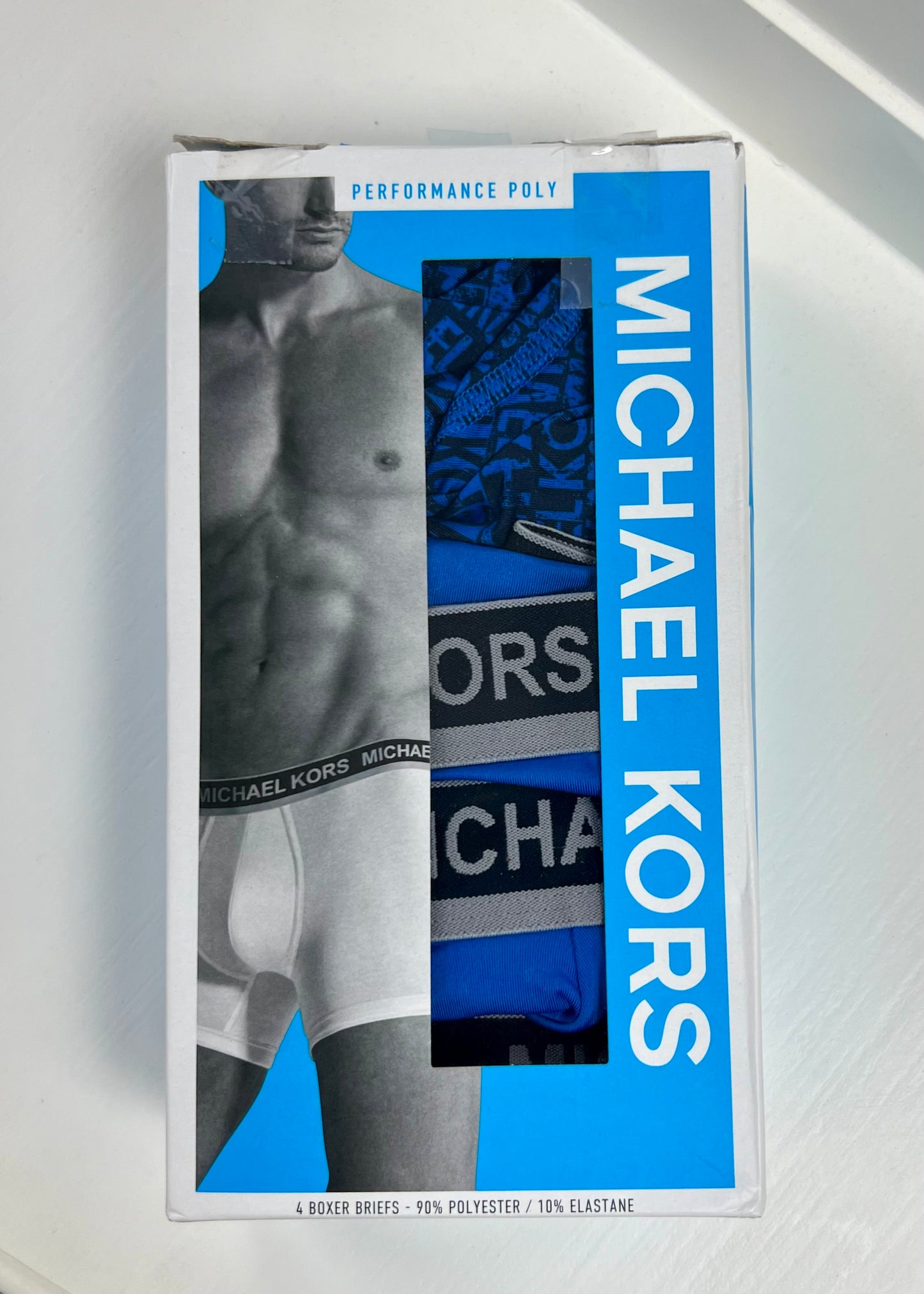 Combo de 4 Boxers Briefs Michael Kors color Azul y negro Talla S