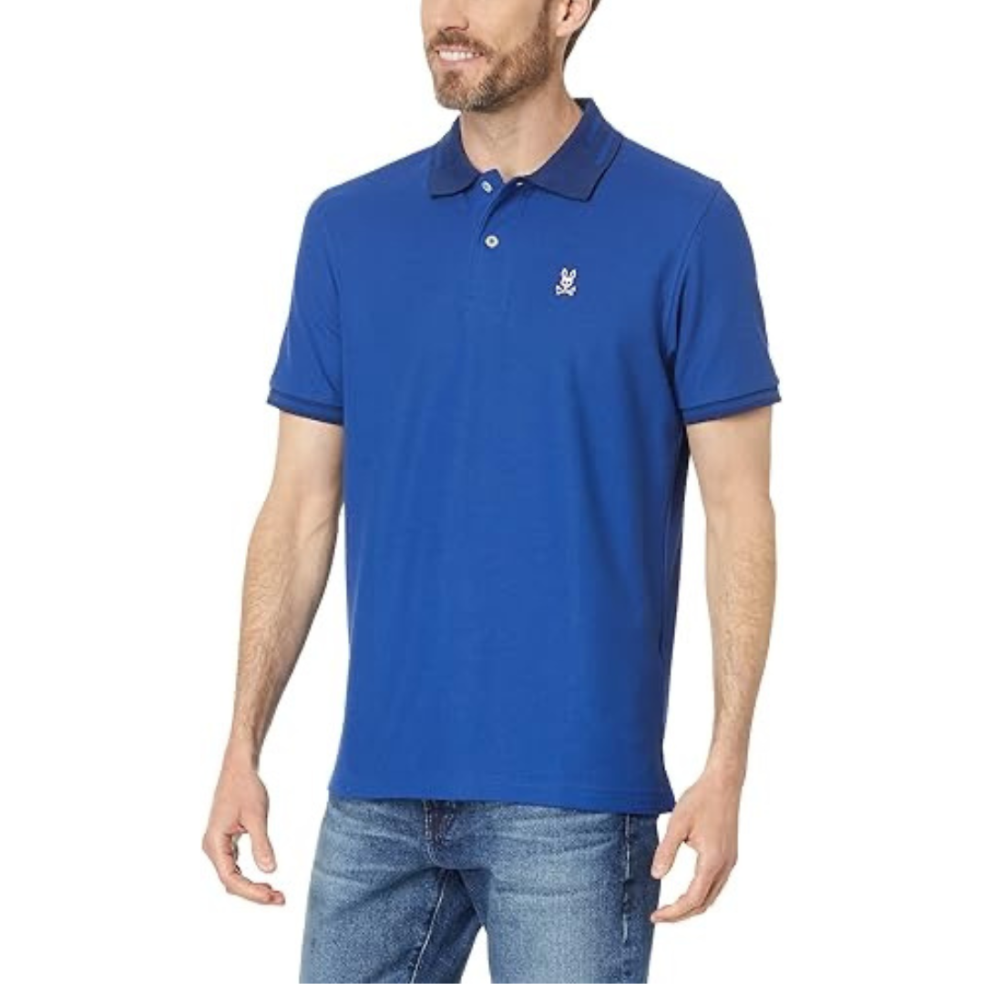 Camiseta Polo Psycho Bunny 🐰 Pique en color azul con diseño de cuello en azul oscuro Talla L Entalle Regular