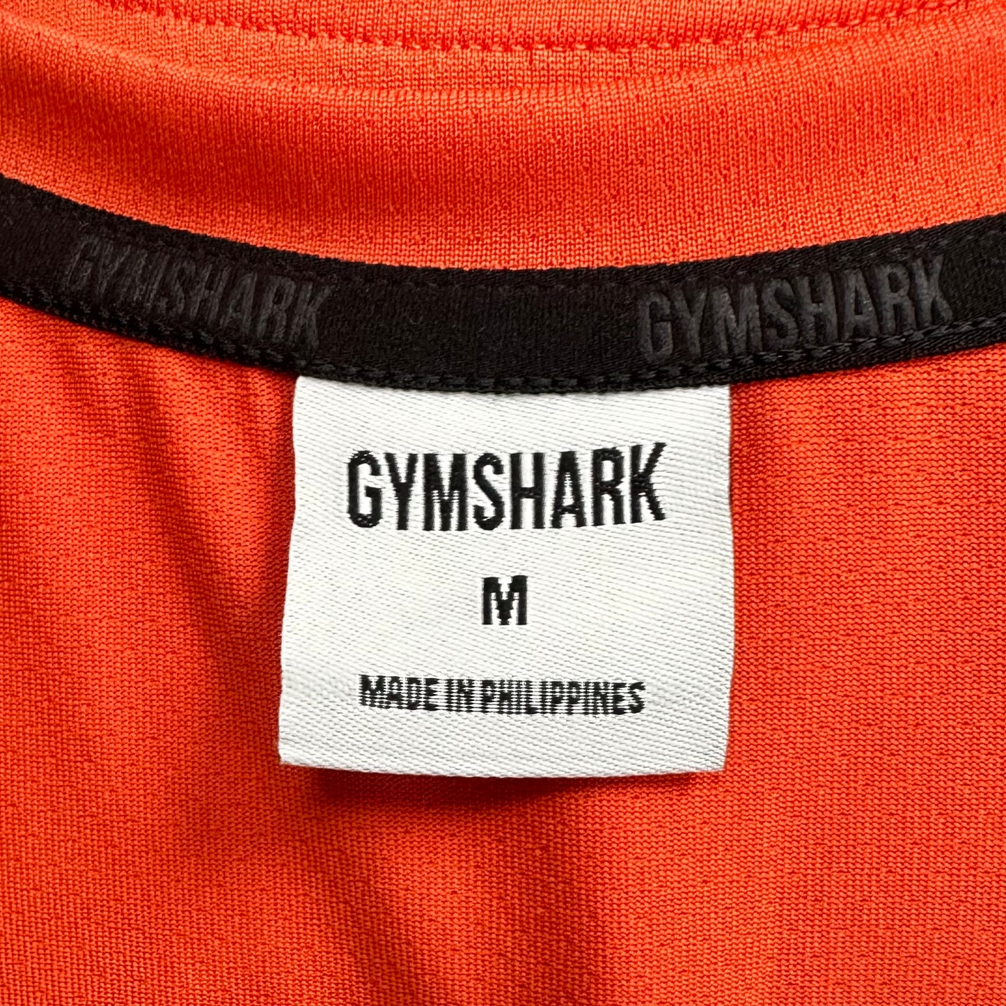 Camiseta de entrenamiento sin mangas Gymshark 🏋🏽 color naranja y logo en blanco Talla M