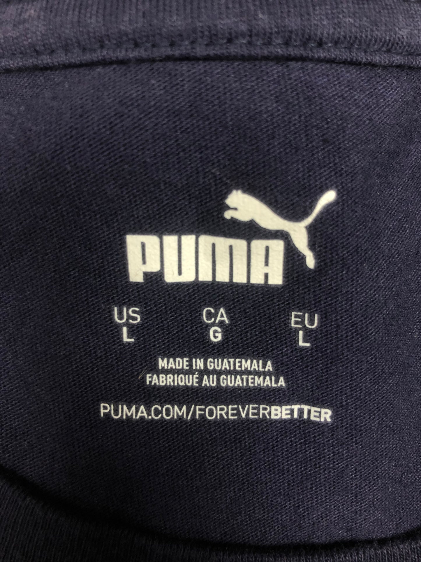 Camiseta cuello redondo Puma 🐆 color azul navy con el logo Puma Head en blanco Talla L