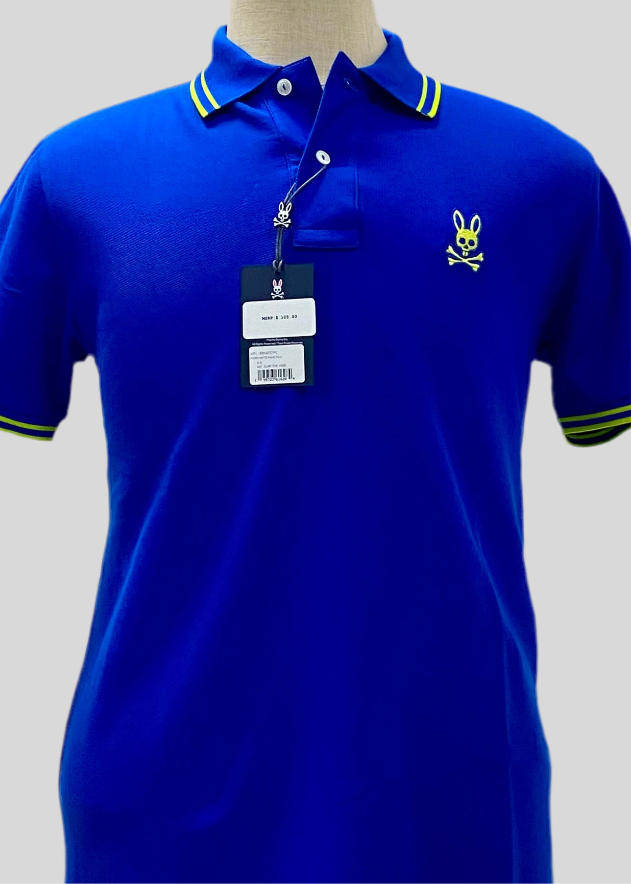Camiseta Polo Psycho Bunny 🐰 Pique en color azul con diseño de cuello en verde intenso Talla S Entalle Regular