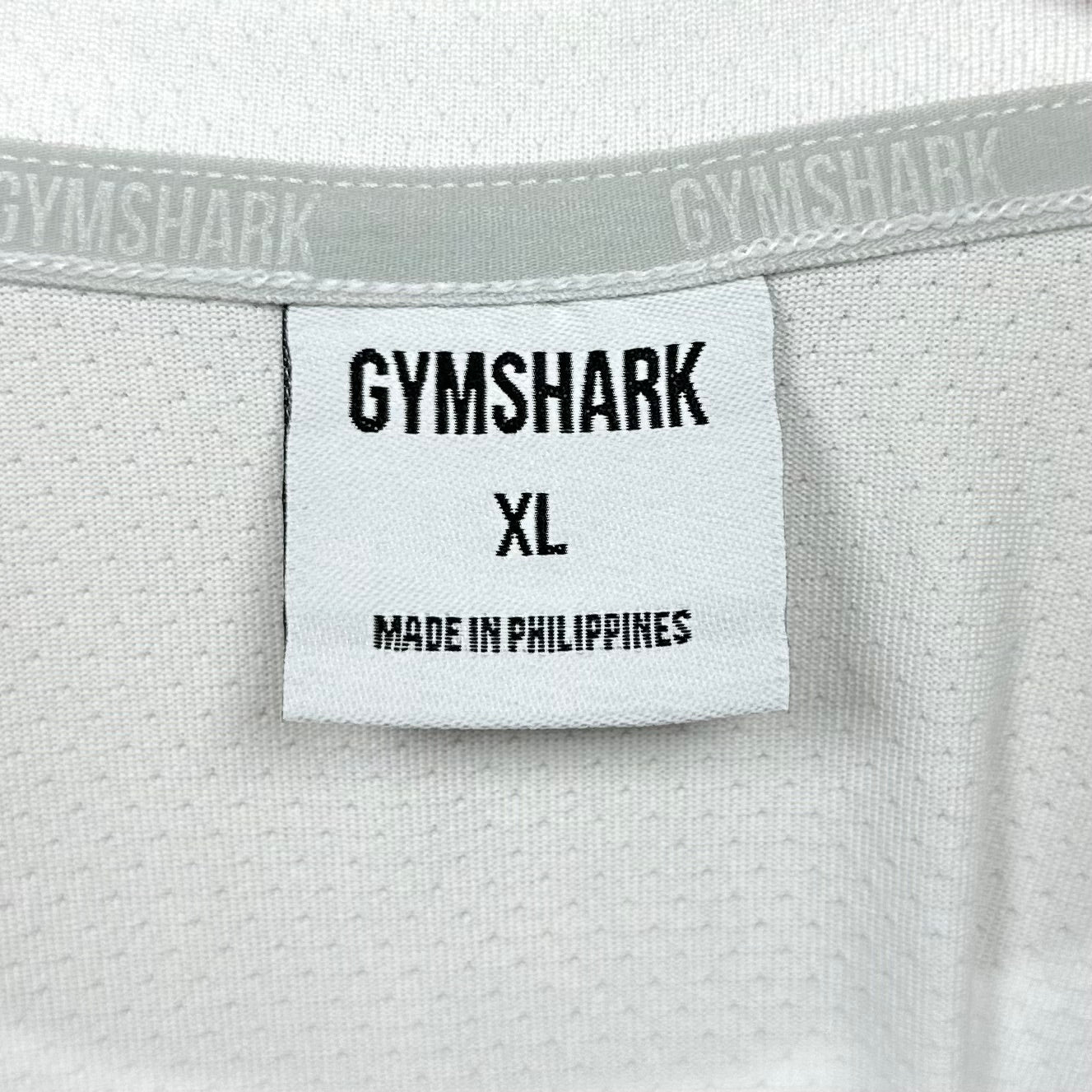 Camiseta de entrenamiento Gymshark 🏋🏽 color blanco y logo en negro Talla XL