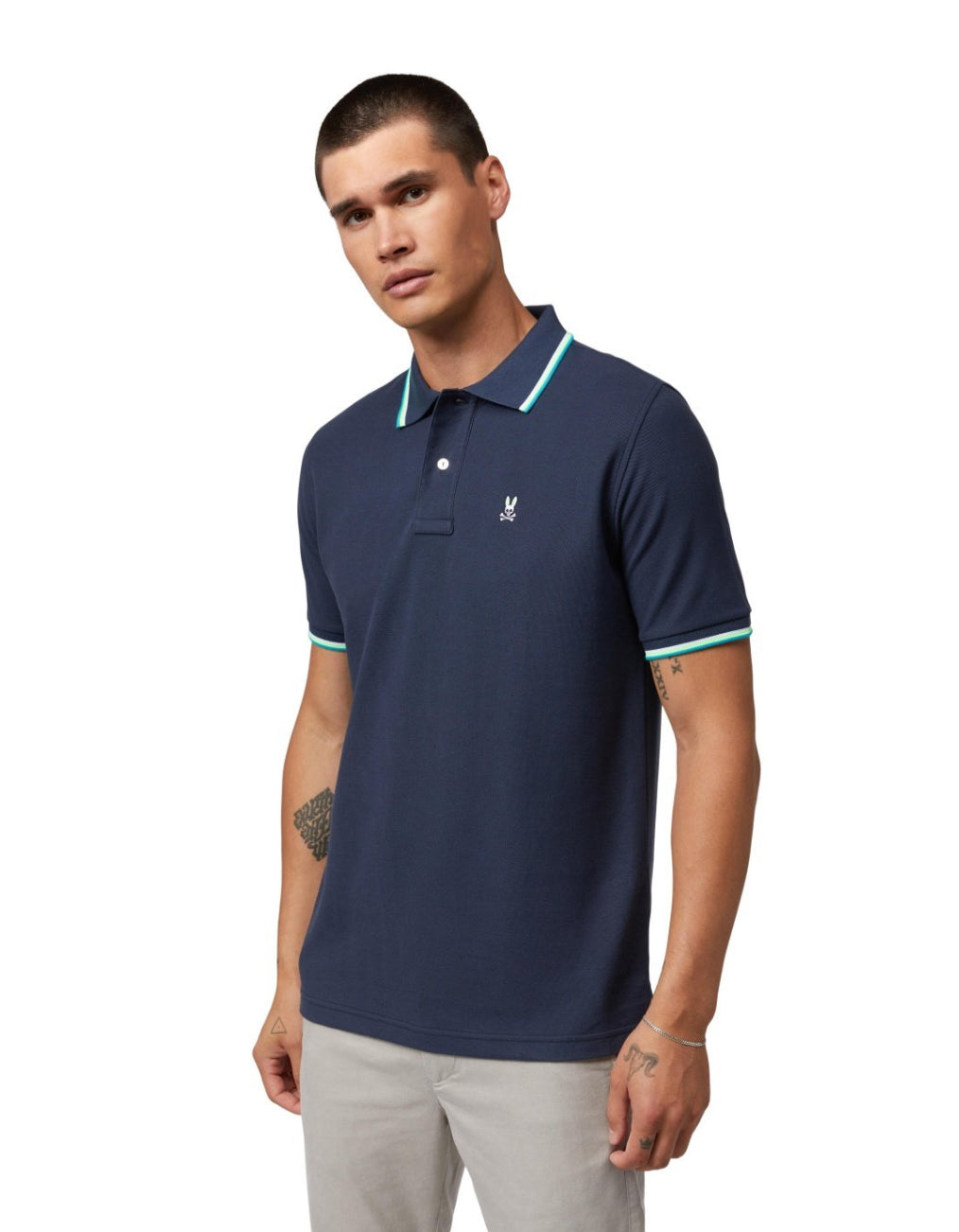 Camiseta Polo Psycho Bunny 🐰 Pique en color azul navy con diseño de cuello en blanco y verde Talla M Entalle Regular