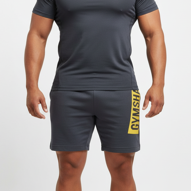 Short Lounge Gymshark 🏋🏼‍♂️ color gris oscuro y logo en amarillo Talla M