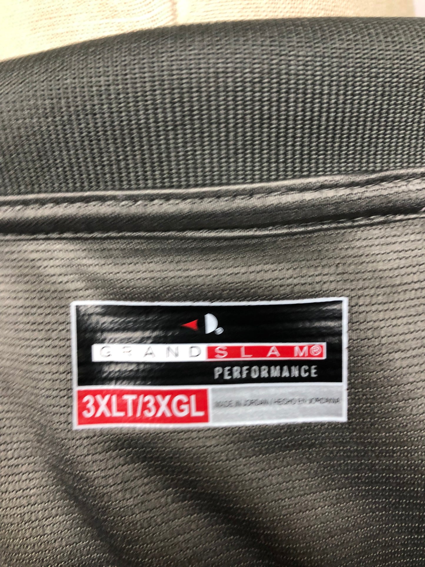 Camiseta Polo Grand Slam 🏌🏽‍♂️ Tela performance de rayas en color gris oscuro Talla 3XL Entalle Regular