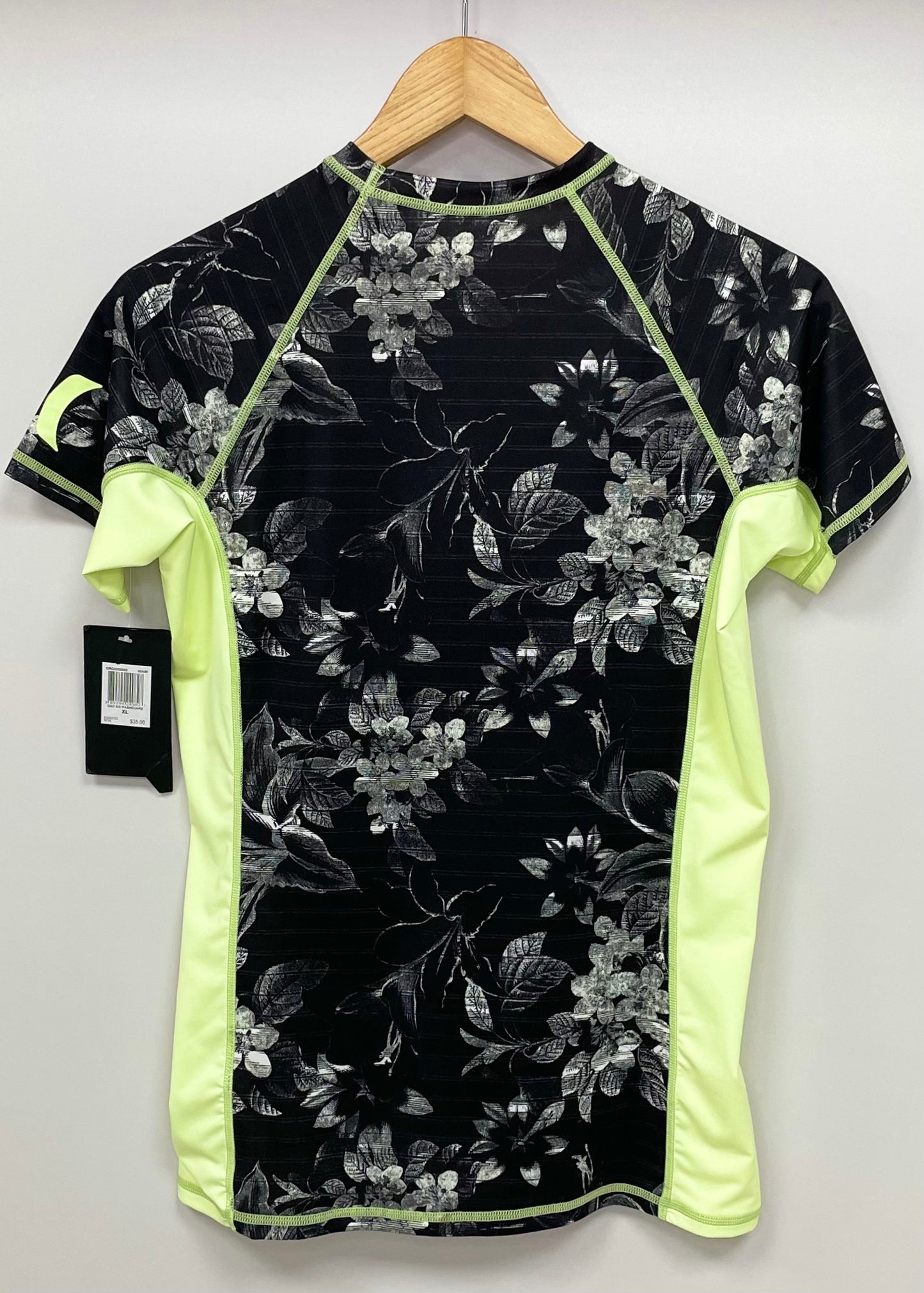 Camiseta de baño Hurley 🏄🏽‍♂️  color negro y verde claro con diseño floral Talla XL de mujer