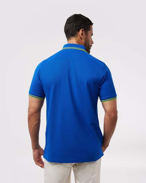 Camiseta Polo Psycho Bunny 🐰 Pique en color azul con diseño de cuello en verde intenso Talla S Entalle Regular