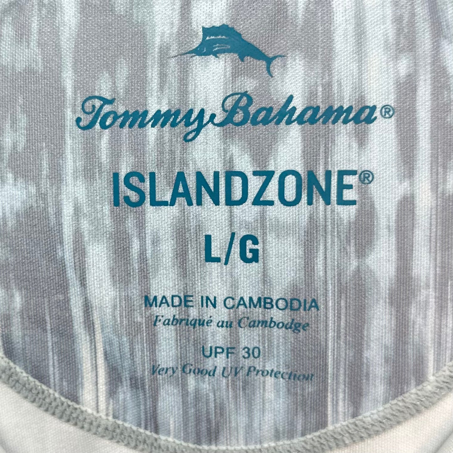 Camiseta Polo Tommy Bahama 🐬 color gris y blanco con diseño floral Talla L Entalle Regular