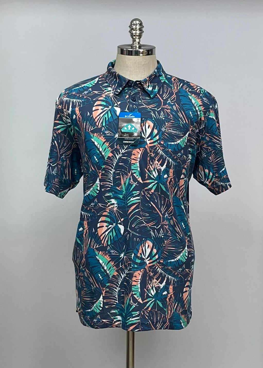 Camisa Columbia 🔹Color azul oscuro con diseño de palmeras en blanco y naranja manga corta Talla XL