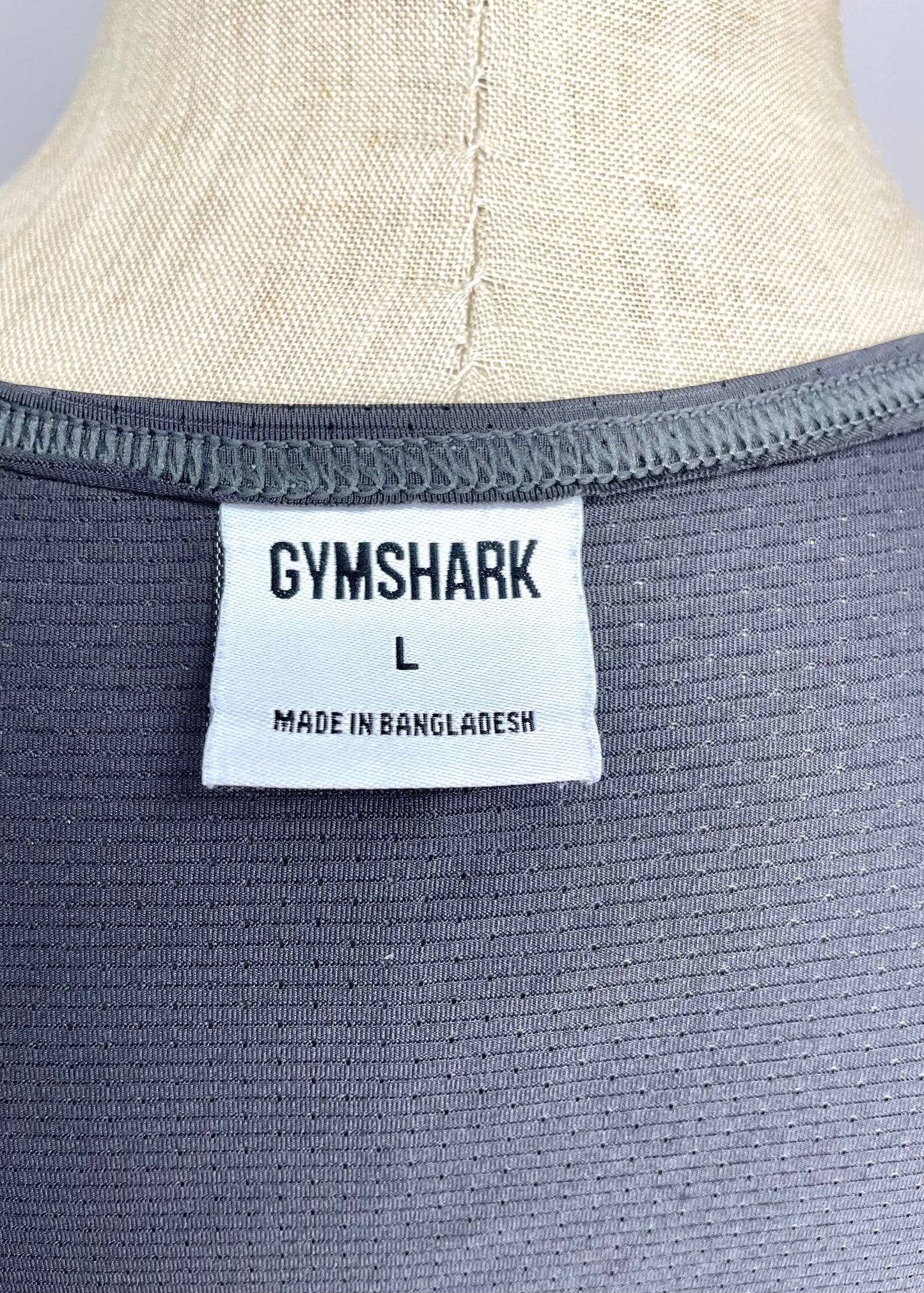 Camiseta de entrenamiento sin mangas Gymshark 🏋🏽 color gris y logo de letras en gris oscuro Talla L