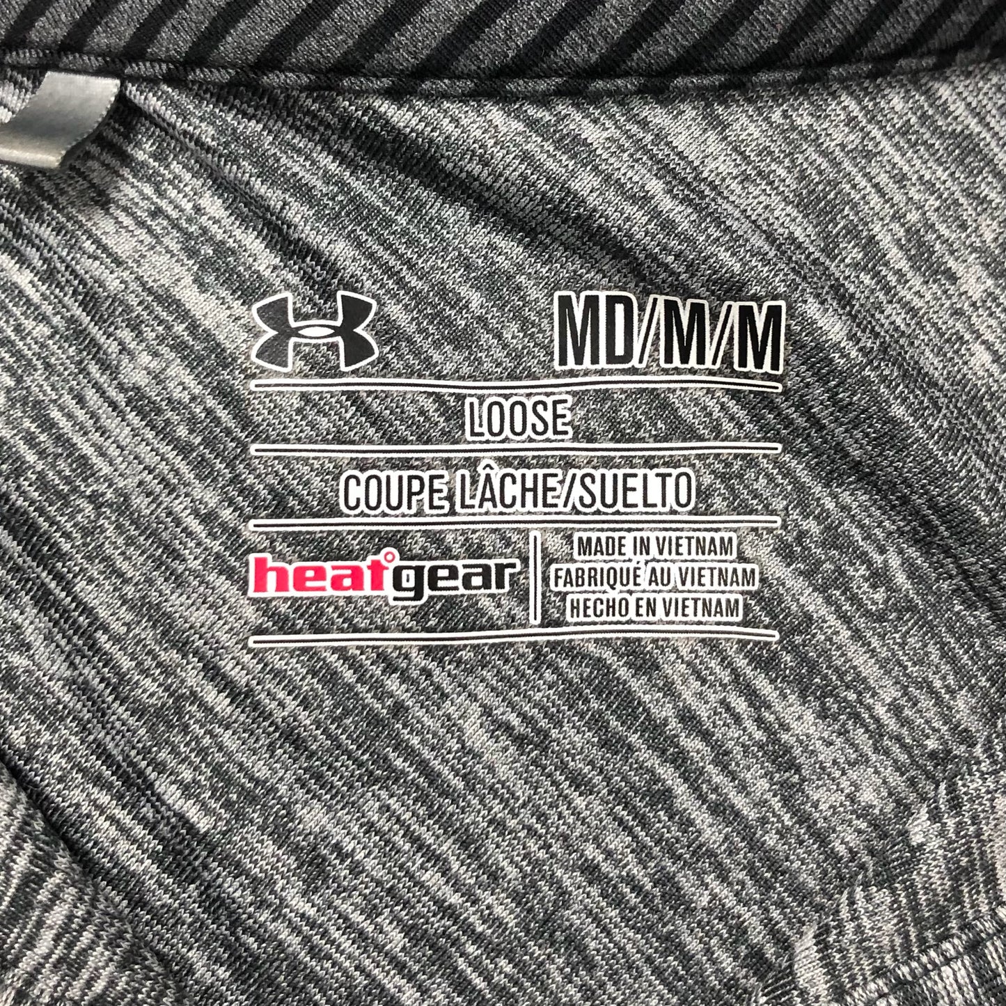 Camiseta polo Under Armour 🏋🏻 color gris y negro Tela Performance Talla M Entalle Regular