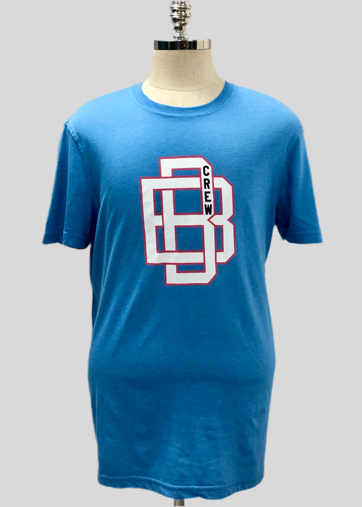 Camiseta cuello redondo Brooks Brothers 🐑 color celeste y diseño de logo universitario Talla L