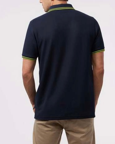 Camiseta Polo Psycho Bunny 🐰 Pique en color azul navy con diseño de cuello en verde intenso Talla M Entalle Regular