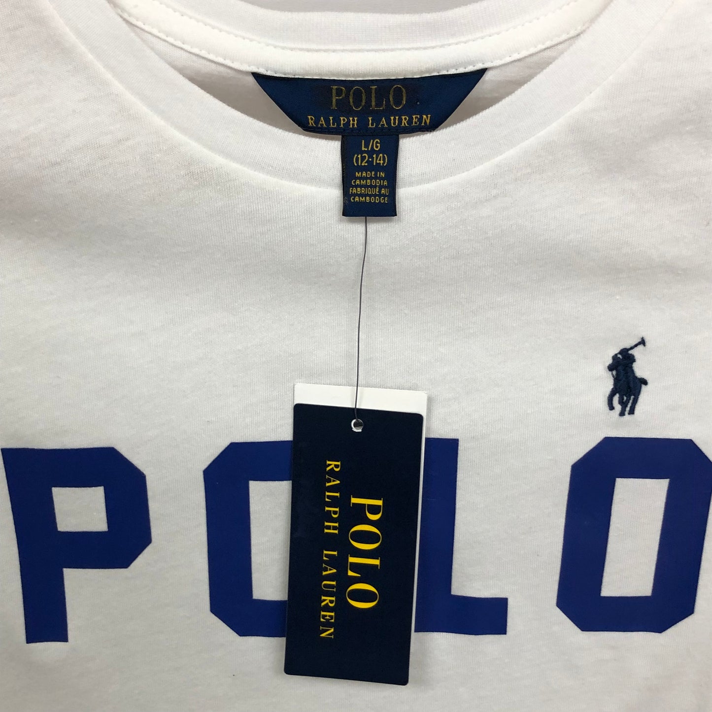 Camiseta cuello redondo de niña Ralph Lauren 🏇🏼  color blanco y logo en letras azul Talla L (12-14) Entalle Regular