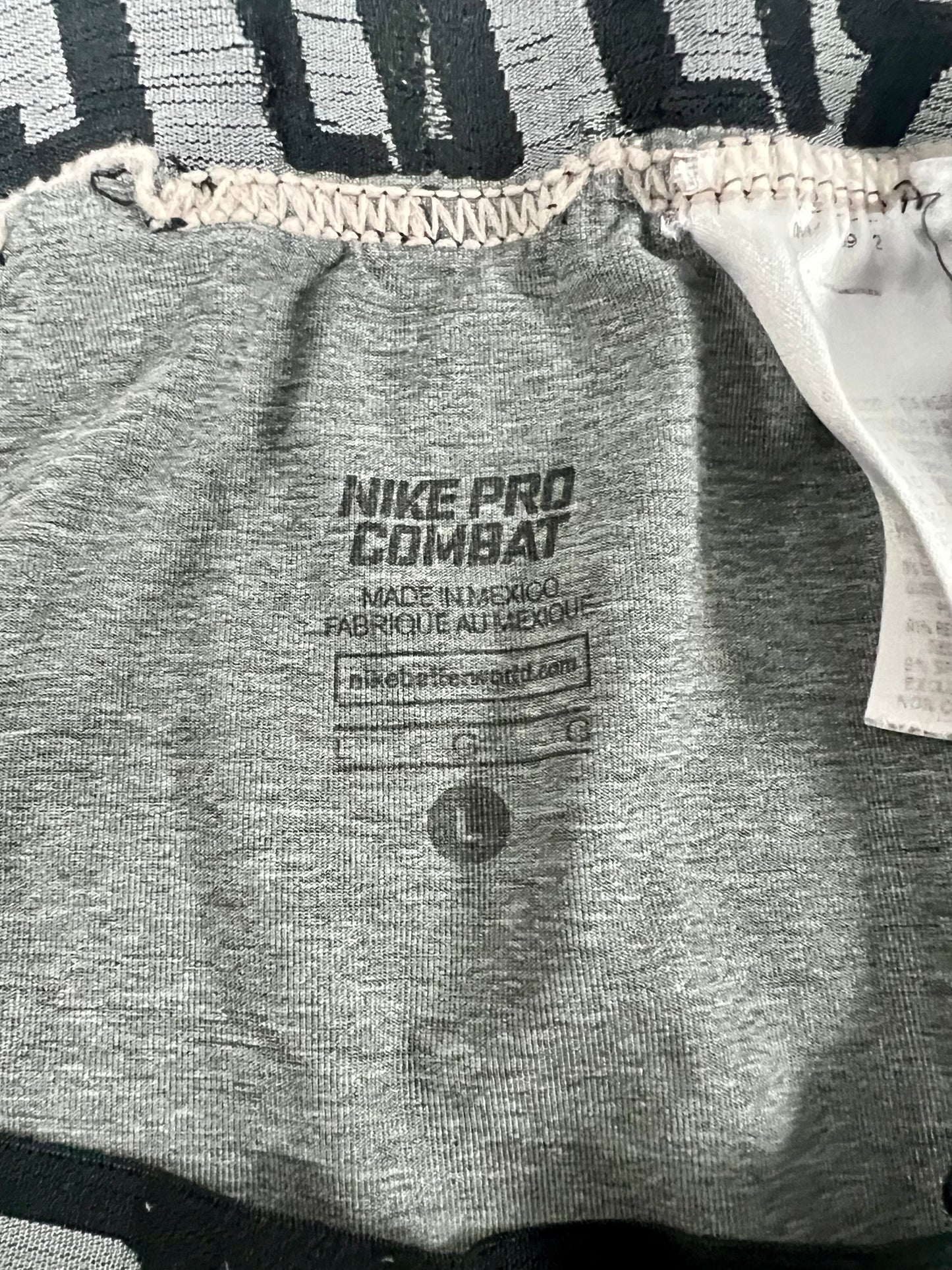 Malla de entrenamiento licra Nike ✔️ Pro Dri-FIT de 3/4 de largo para hombre en Color gris cintura negro Talla L