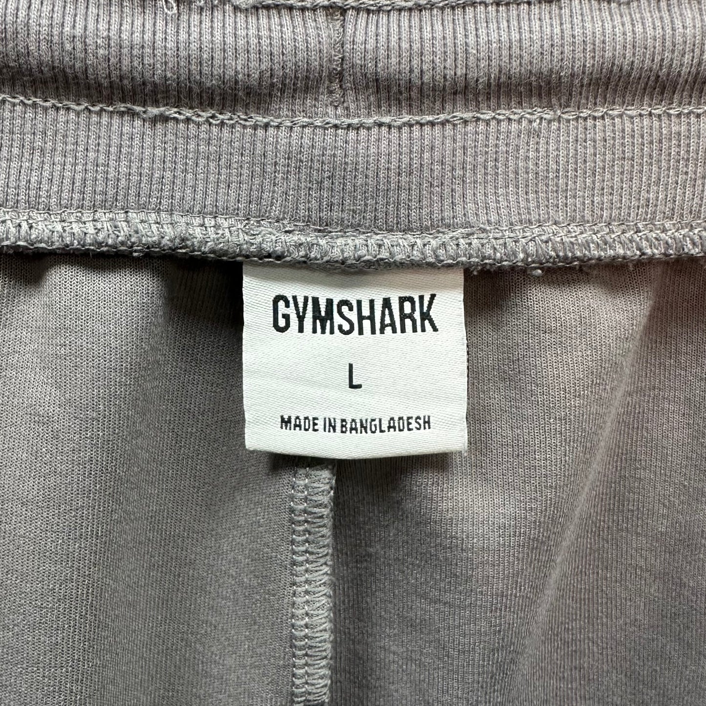 Short Lounge Gymshark 🏋🏼‍♂️ color gris claro y logo en blanco Talla L