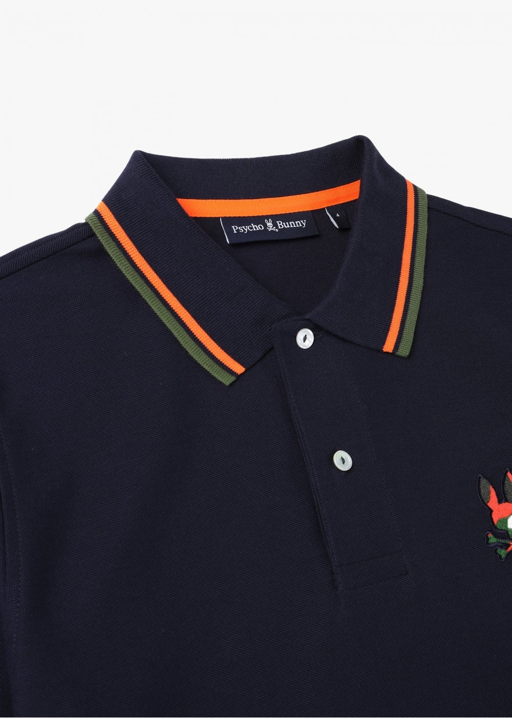 Camiseta Polo Psycho Bunny 🐰  Pique en color azul navy y naranja con diseño de cuello Talla M Entalle Regular