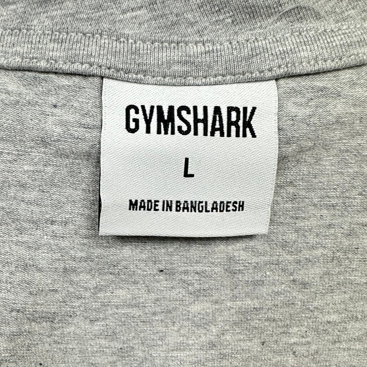 Camiseta de entrenamiento sin mangas Gymshark 🏋🏽 color gris claro y logo de letras en negro Talla L