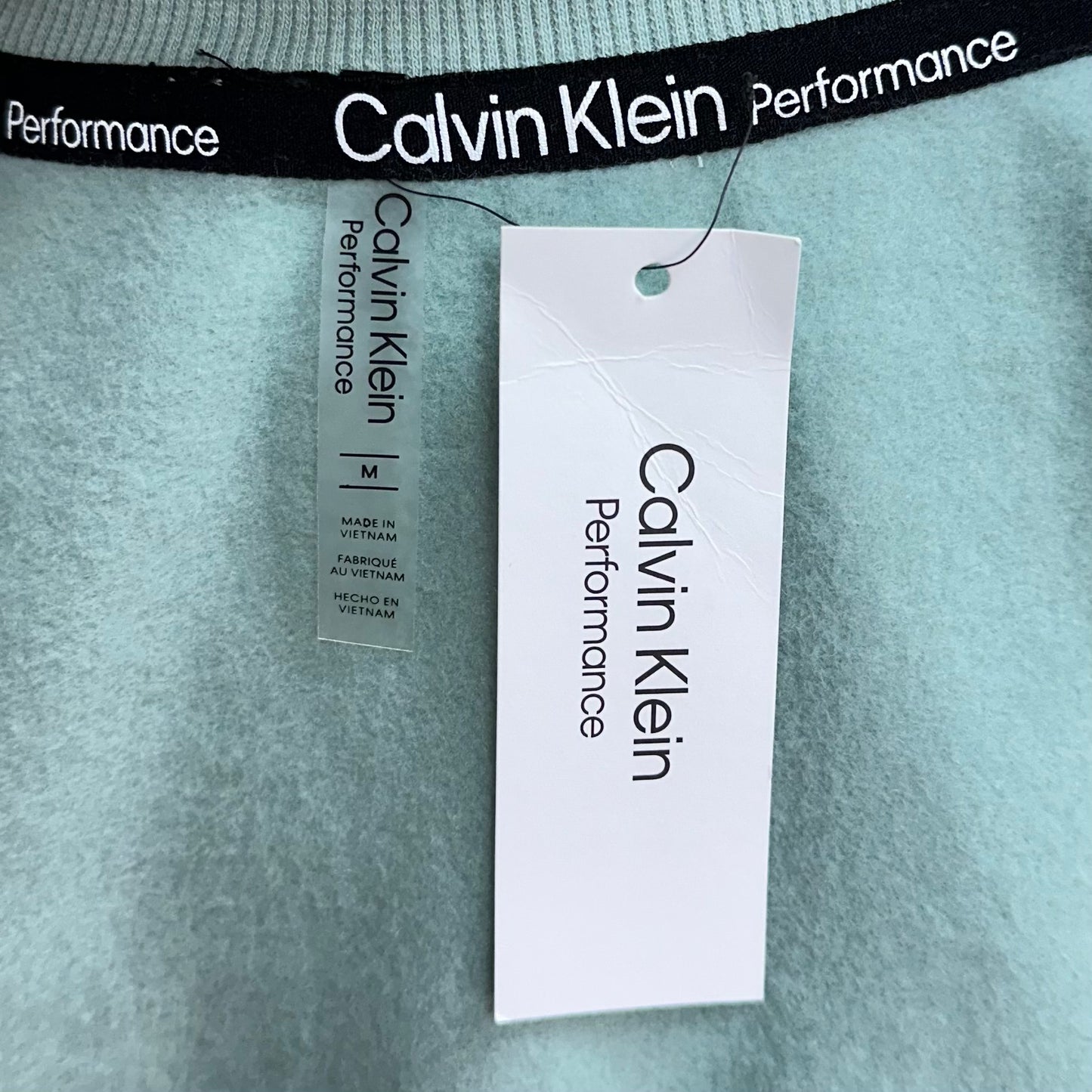 Camiseta crop top de mujer Calvin Klein Performance manga larga en color turquesa Talla M