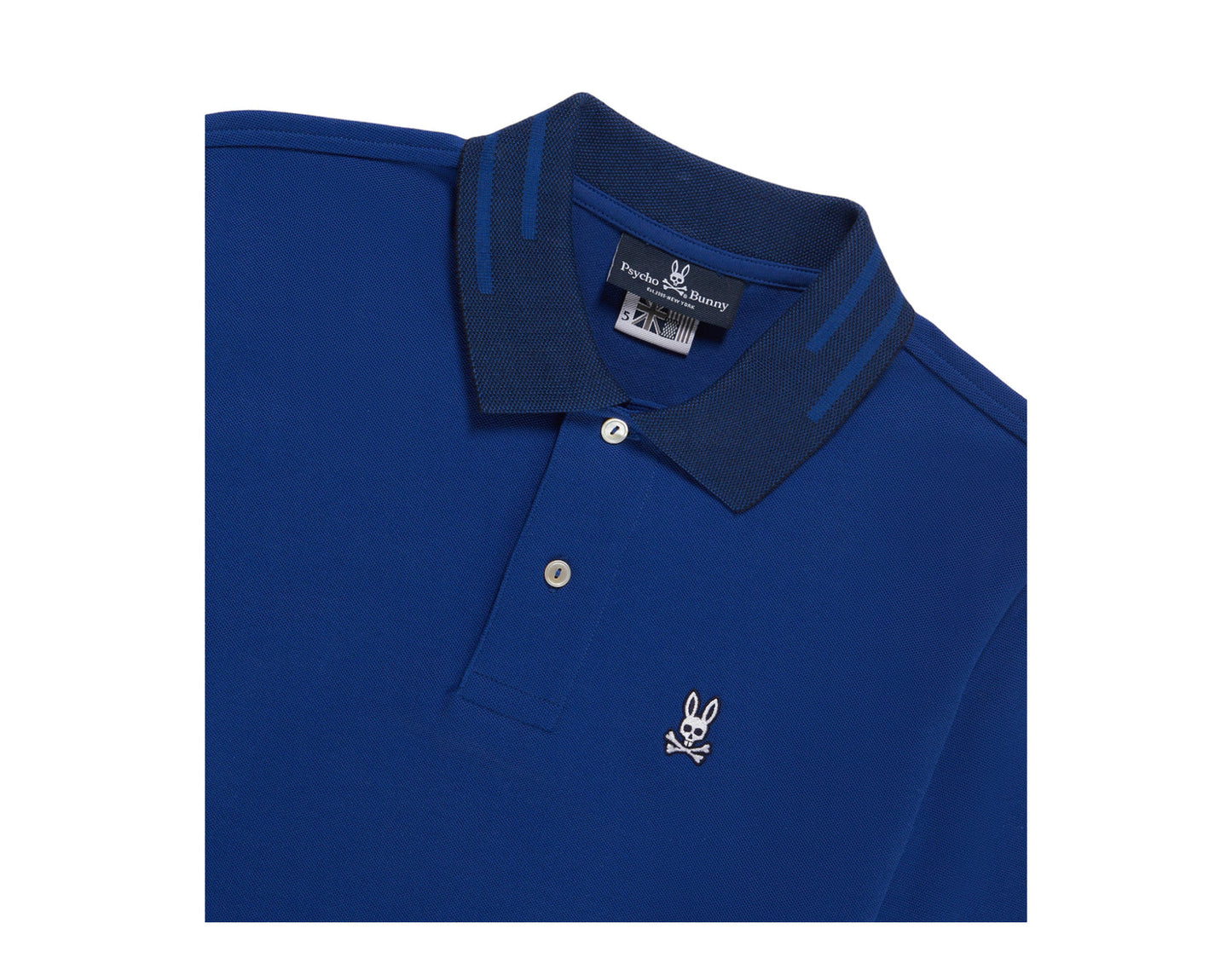 Camiseta Polo Psycho Bunny 🐰 Pique en color azul con diseño de cuello en azul oscuro Talla L Entalle Regular