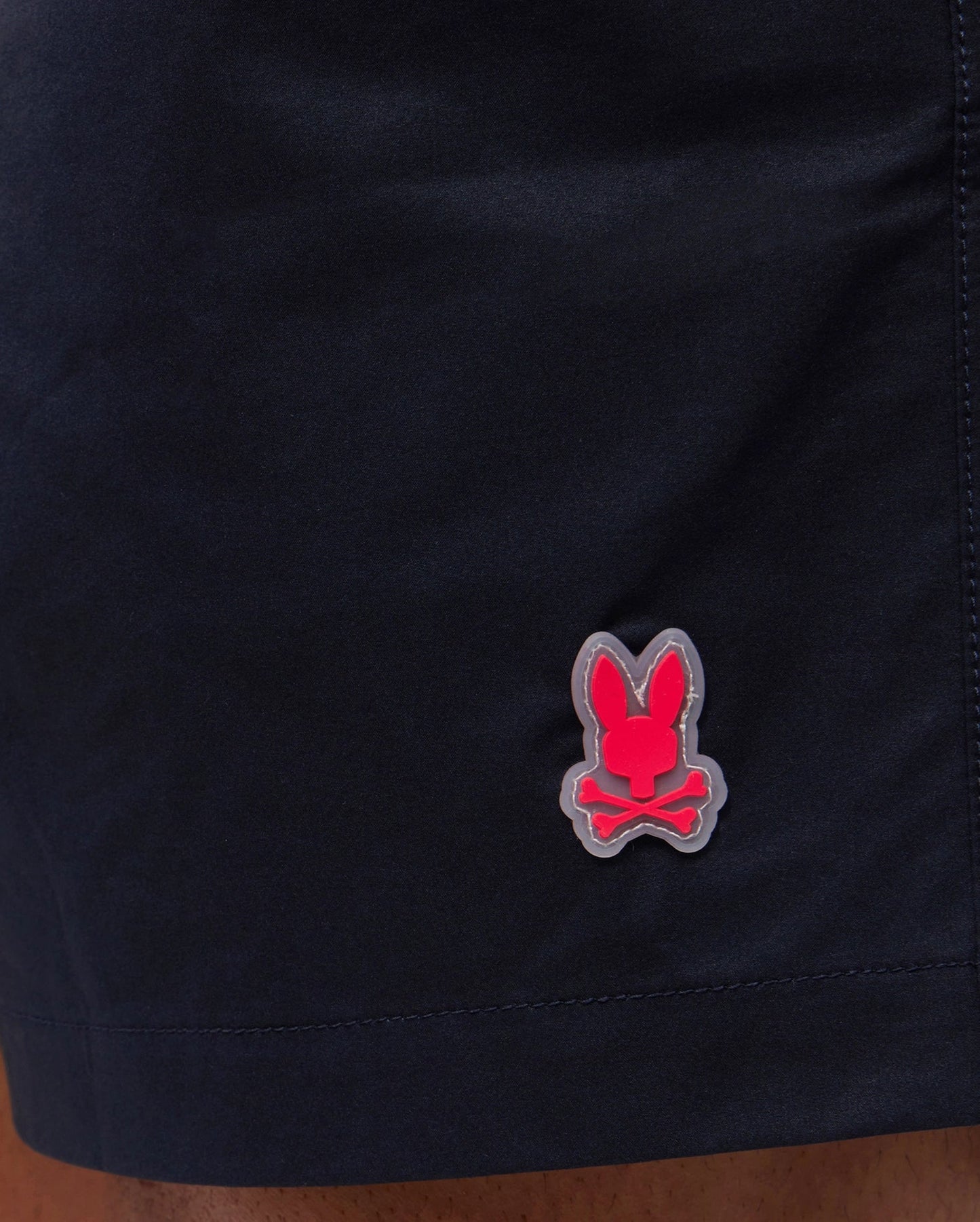 Short de baño Psycho Bunny 🐰  color azul navy y logo tradicional en naranja intenso Talla M