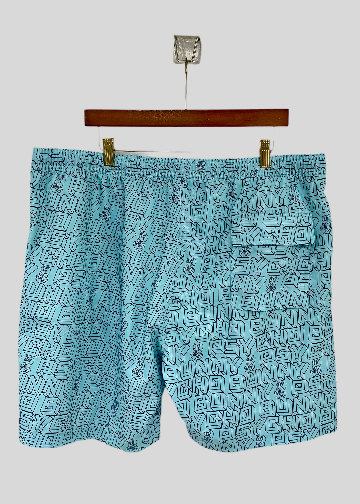 Short de baño Psycho Bunny 🐰  color celeste y logo en letras en negro Talla 3XL