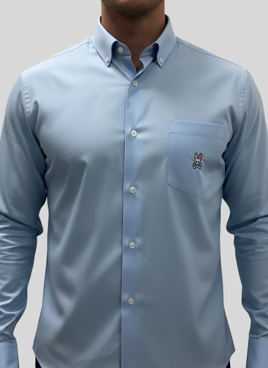 Camisa de botones Psycho Bunny 🐰  Color celeste claro con logo tradicional Talla L Entalle Regular