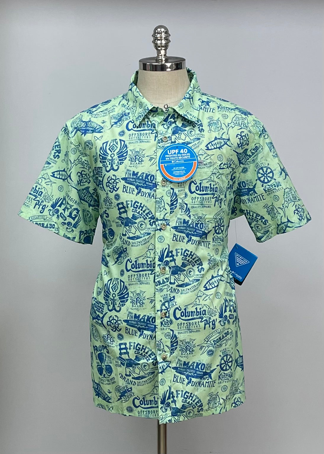 Camisa Columbia 🔹Color verde con diseño de pesca en azul Talla L Manga corta