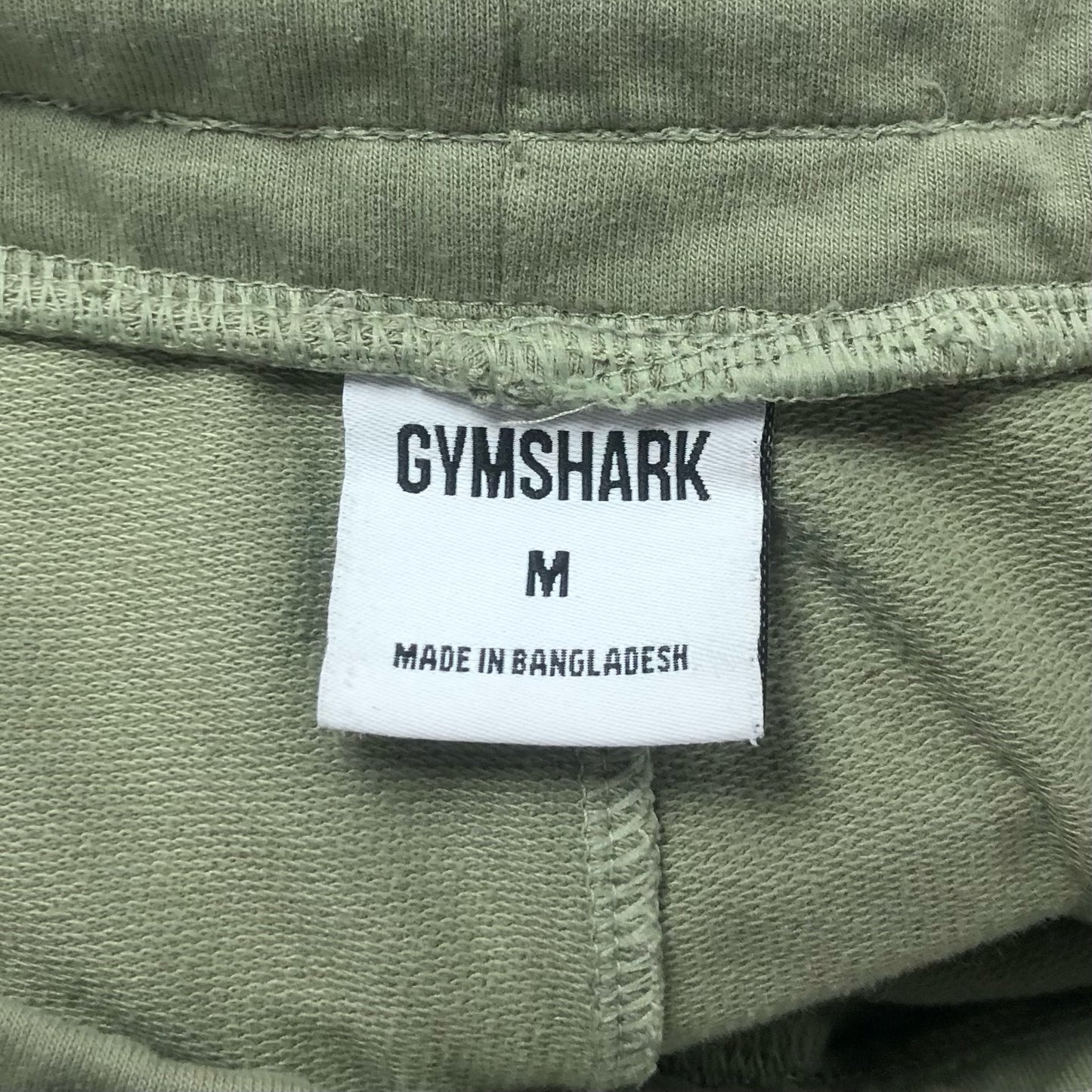 Short Lounge Gymshark 🏋🏼‍♂️ color verde oliva y logo en blanco Talla M (ver descripción)