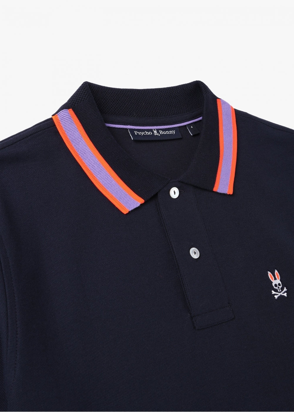 Camiseta Polo Psycho Bunny 🐰 Pique en color azul navy con diseño de cuello en rojo y lila Talla L Entalle Regular