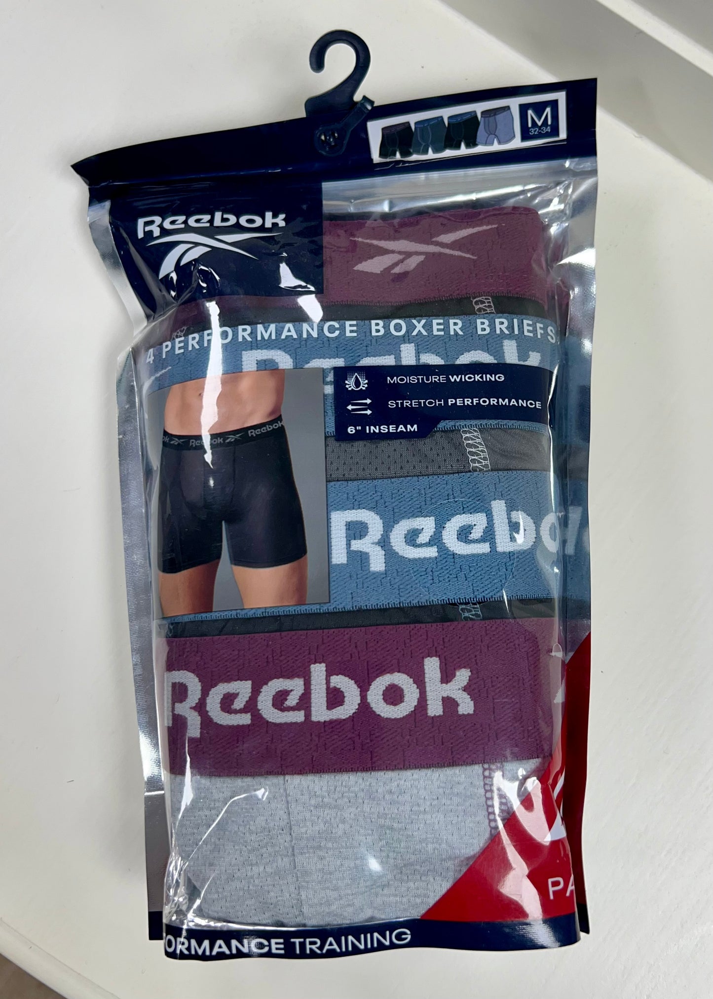 Combo de 4 Boxers Briefs Reebok Tela Performance en color negro y gris Talla M