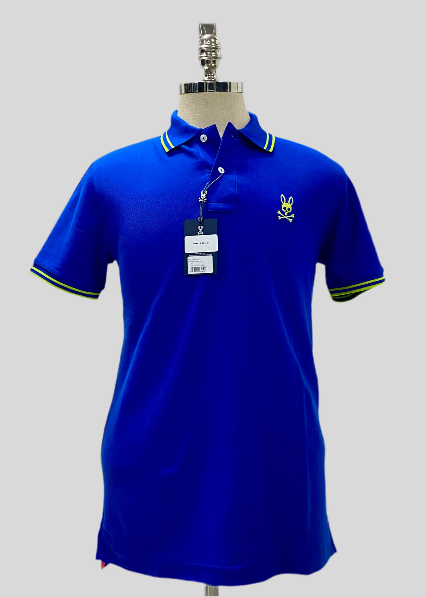 Camiseta Polo Psycho Bunny 🐰 Pique en color azul con diseño de cuello en verde intenso Talla S Entalle Regular