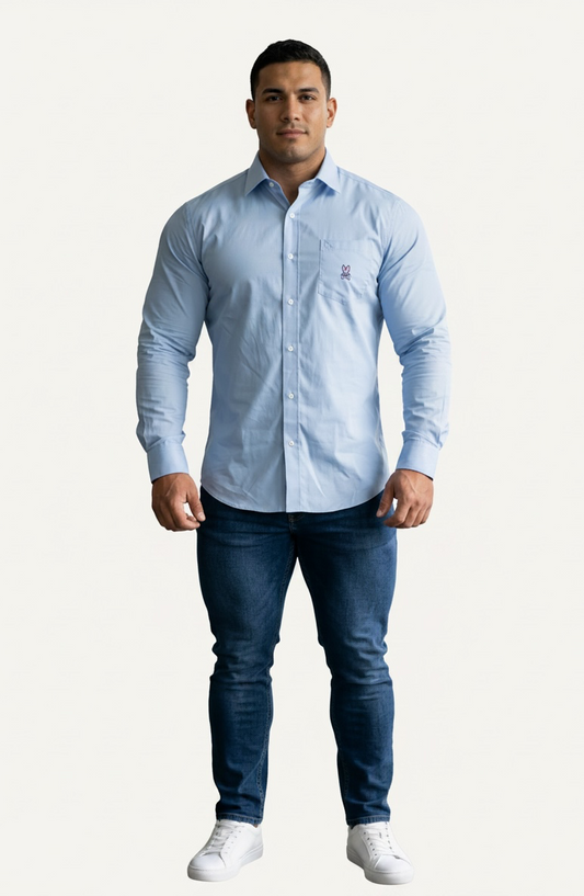 Camisa de botones Psycho Bunny 🐰  Color celeste claro con logo tradicional Talla L Entalle Regular