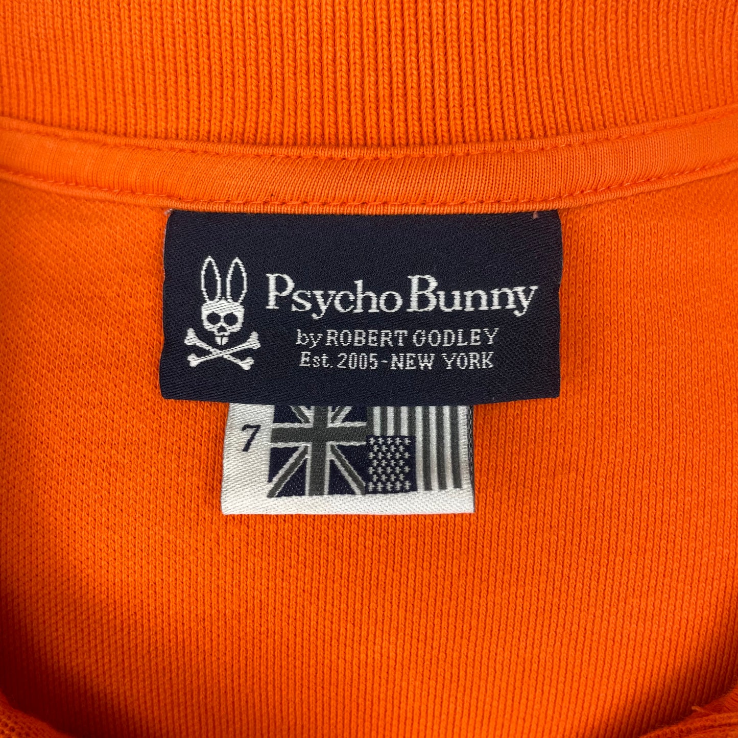 Camiseta Psycho Bunny 🐰  color naranja Talla XL Entalle Regular