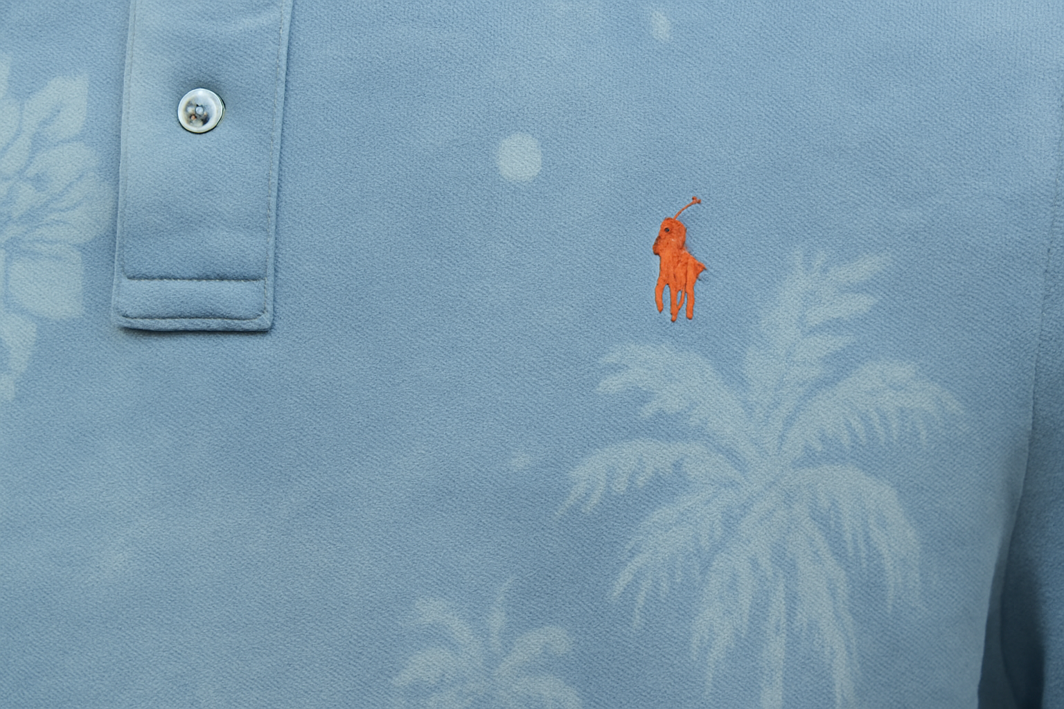 Detail shot of logo and tropical pattern