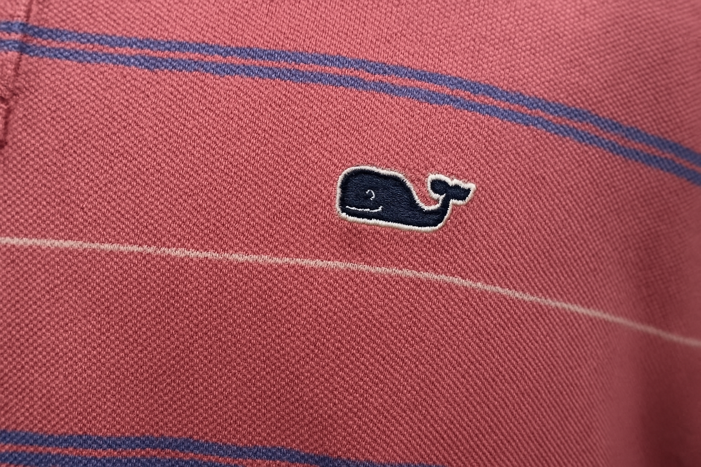 Detail shot of whale logo and stripes