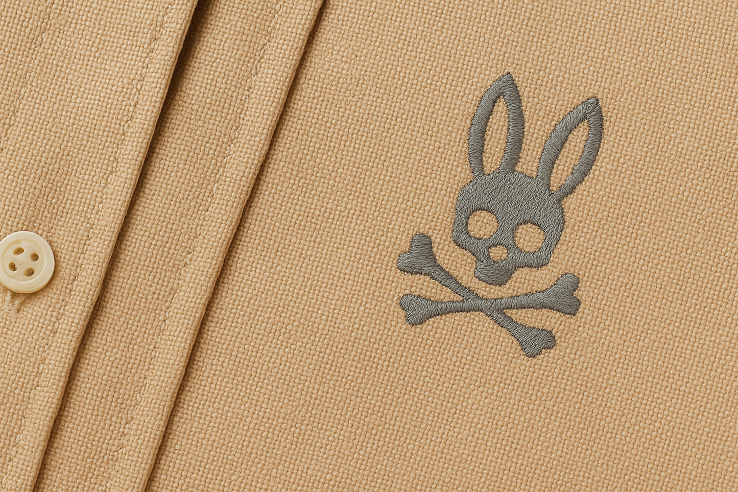 Detalle logo pequeño gris Psycho Bunny