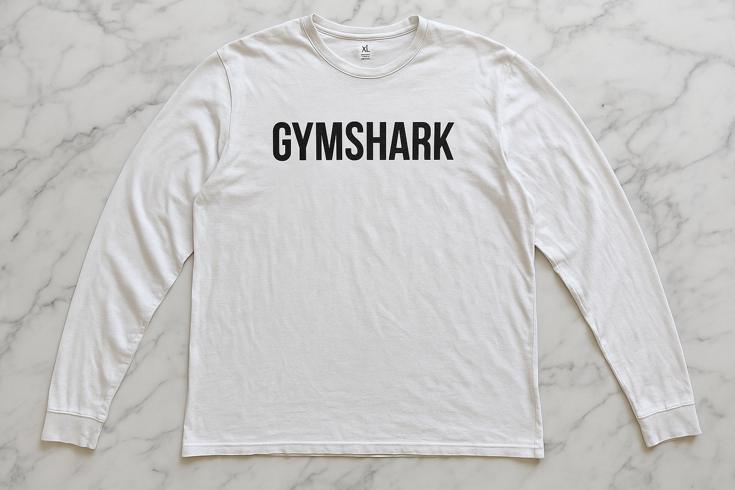 Flat lay - logo "GYMSHARK" centro