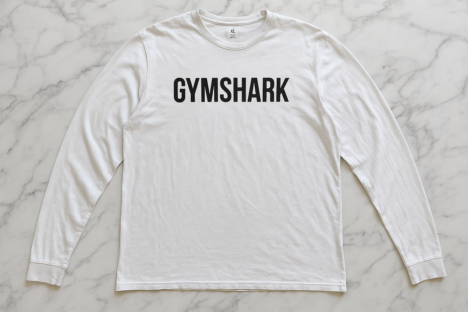 Flat lay - logo "GYMSHARK" centro
